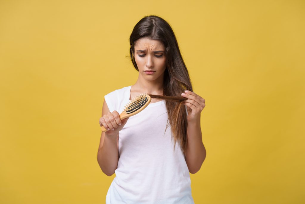 Woman Showing Hair Shedding vs Hair Loss